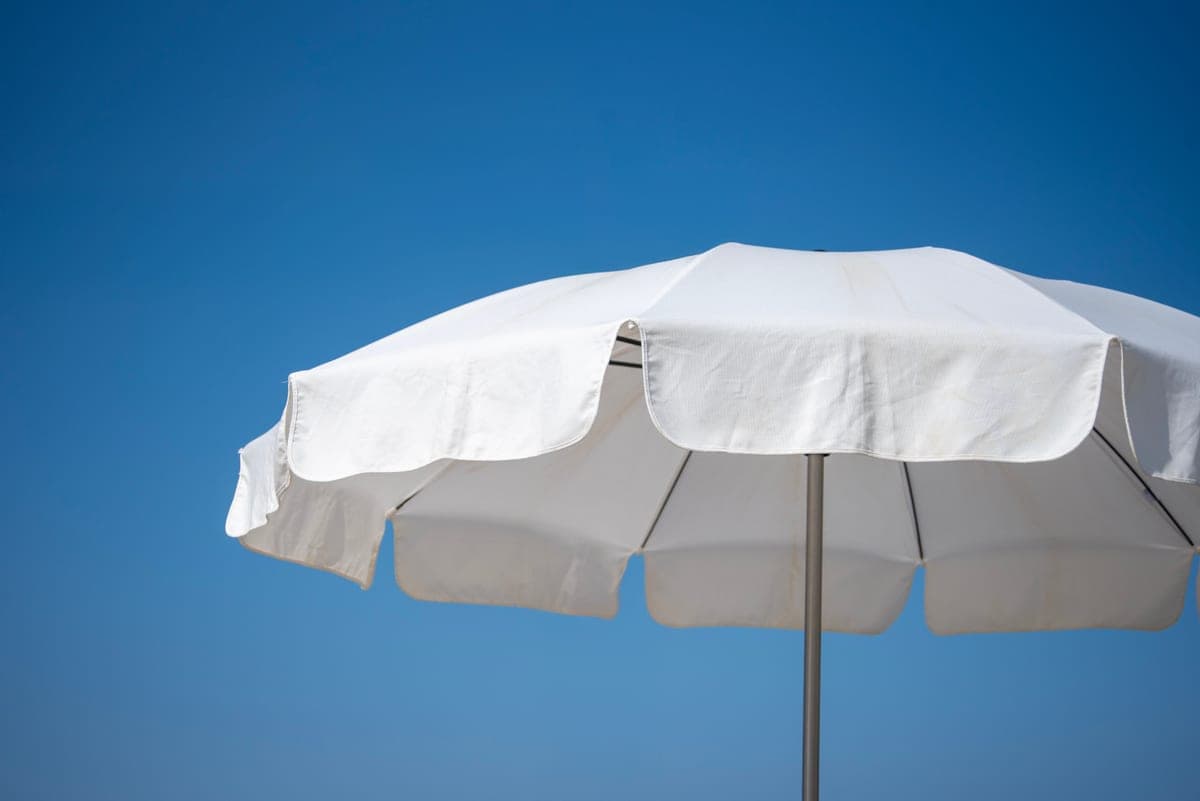 Beach canopy pitched on open sand with the sea behind
