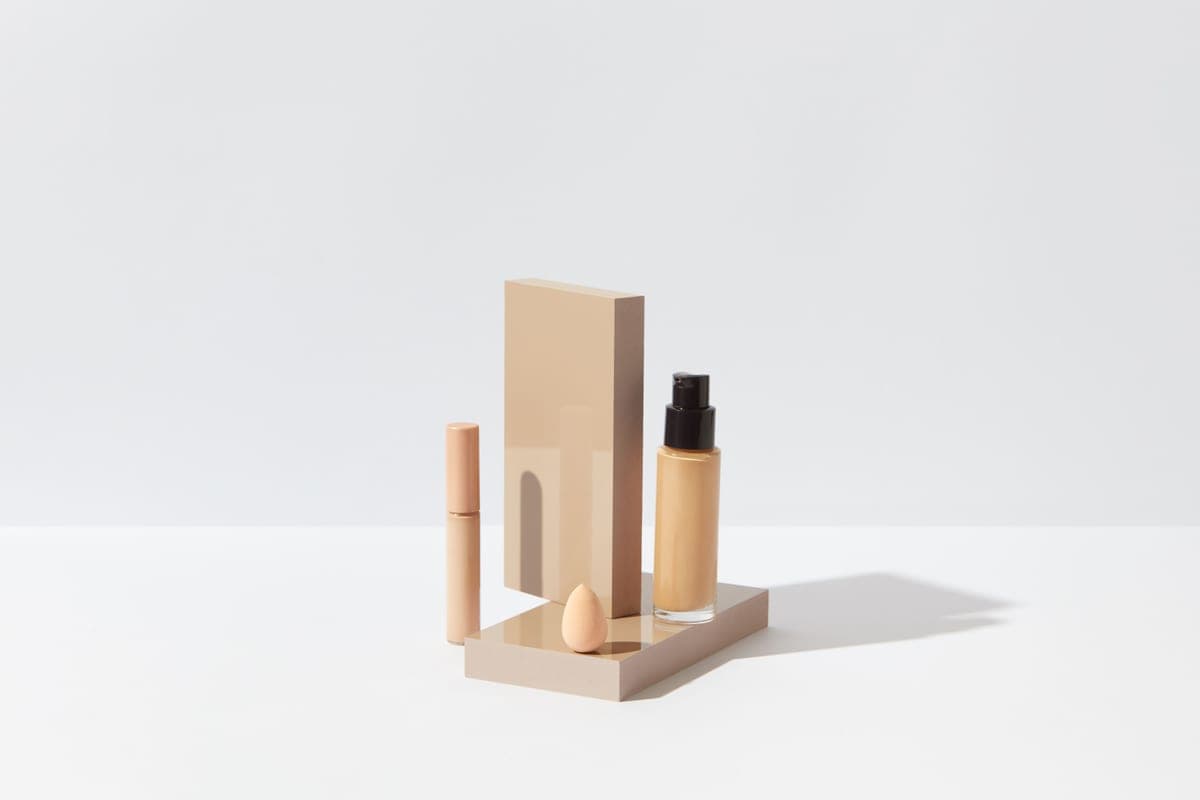 Tinted mineral sunscreen blended across a cheek in natural light