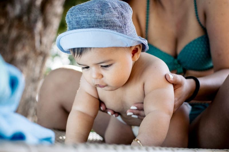 Unscented baby mineral sunscreen tube on a towel