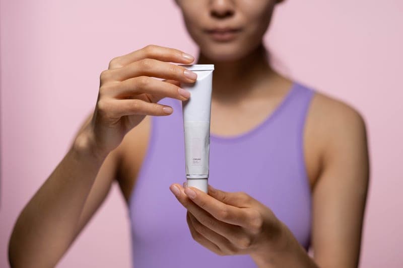 Lightweight face sunscreen tube beside a mirror