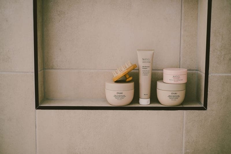 Mineral face sunscreen tube on a bathroom shelf