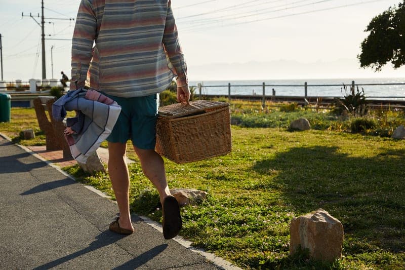 Long-sleeve sun shirt worn on a bright coastal walk