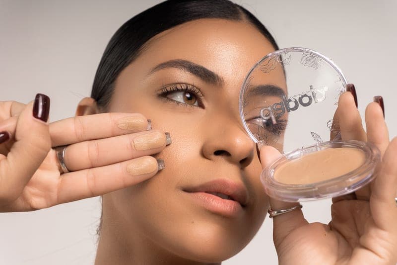 Tinted mineral sunscreen swatched on the back of a hand