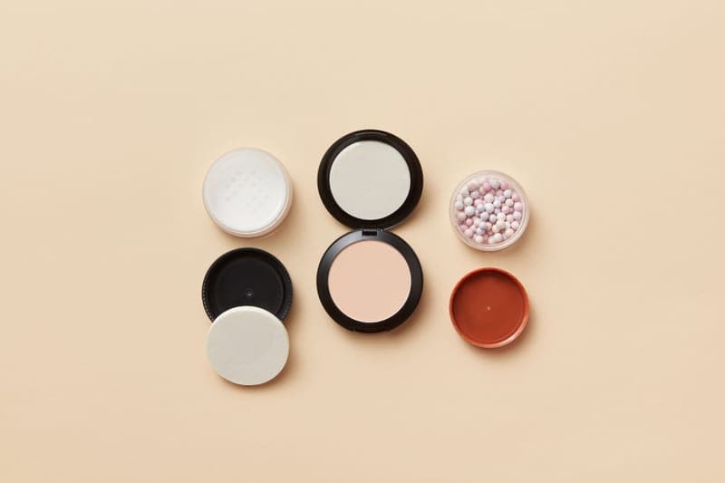 Tinted mineral moisturizer with SPF on a linen surface